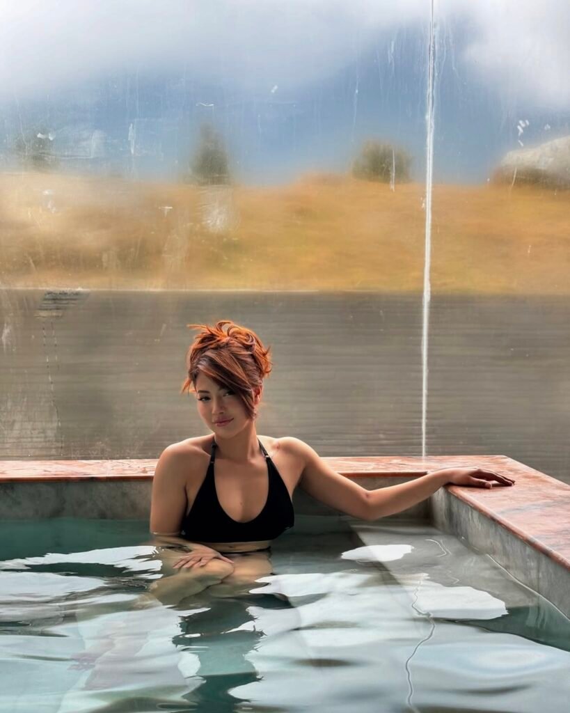 Samragyee laxmi shah in black bikini at pool drinking (3)