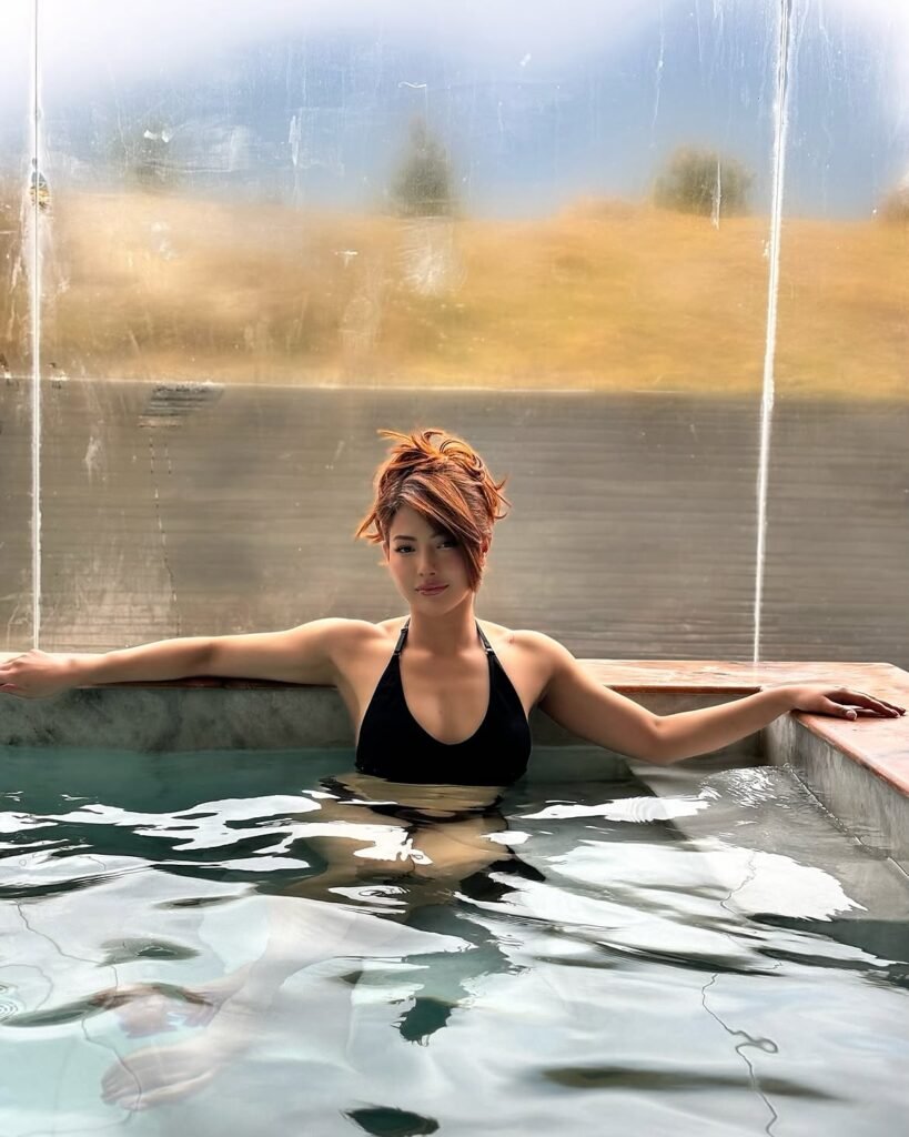 Samragyee laxmi shah in black bikini at pool drinking (4)